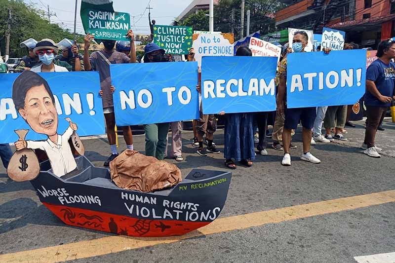 On Earth Day, groups renew call to stop reclamation, dredging projects