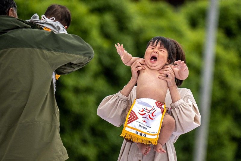 Japan's 'crying baby sumo' festival returns after pandemic