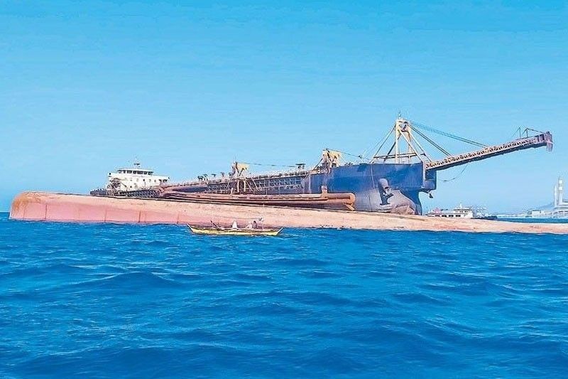 Sunken dredger towed to Bataan â�� Coast Guard