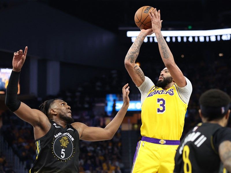 Davis, Lakers weather late 14-0 Warriors run to win opener