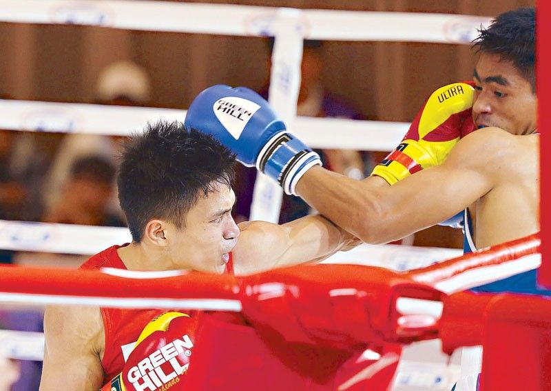 Bautista keeps boxing crown
