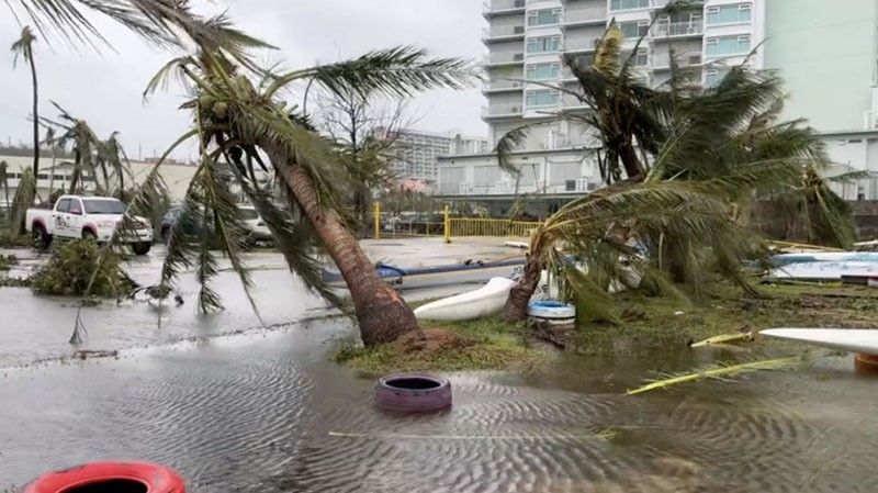 Guam 'weathers storm' as Typhoon Mawar moves west