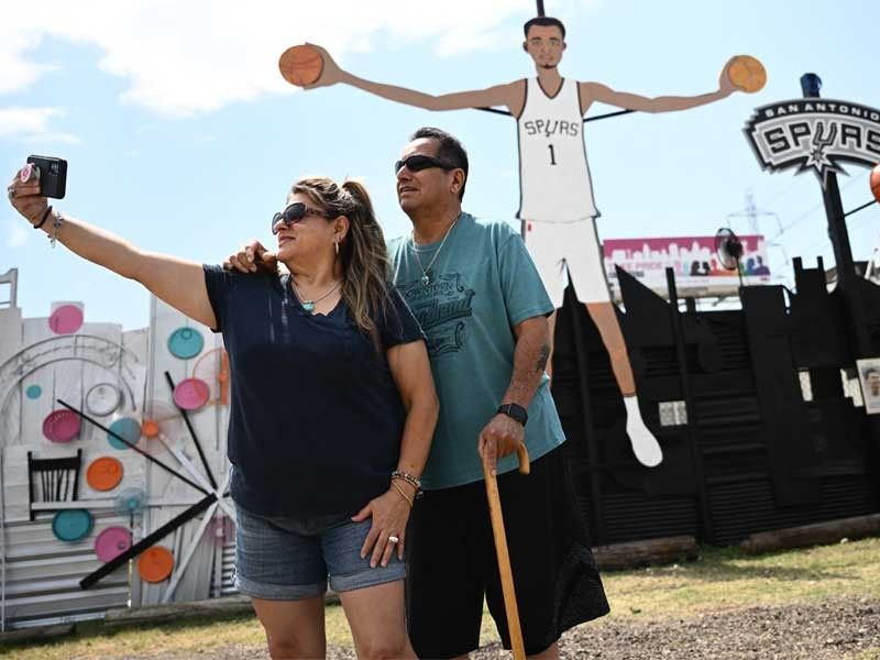 Giant cut-out, prayer candles as 'Wemby-mania' grips San Antonio