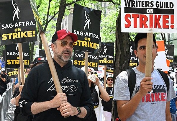 Striking actors join picket lines as Hollywood shuts down