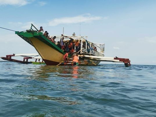 67 rescued from half-submerged boat in Quezon province