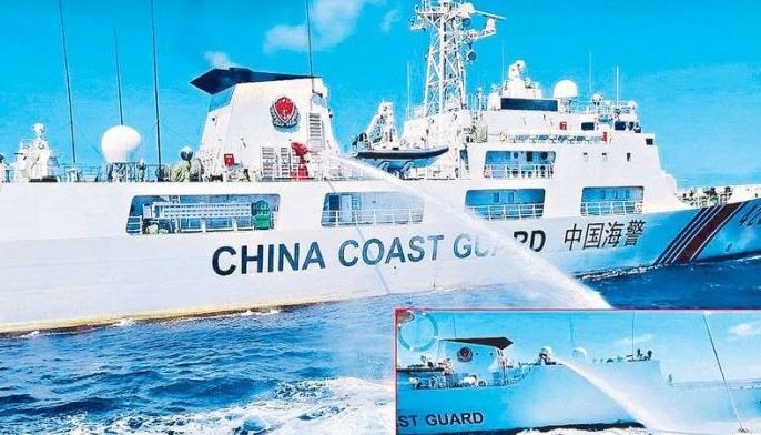 A handout photo released by the Philippine Coast Guard yesterday shows a Chinese Coast Guard ship blasting a PCG vessel with a water cannon near Ayungin Shoal during a resupply mission for Philippine troops on Aug. 5.