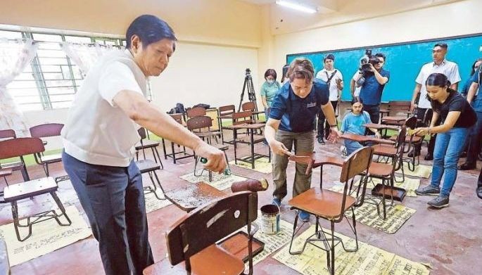 President Marcos and Vice  President and Education  Secretary Sara Duterte  repaint chairs in a classroom  during a visit to the Victorino  Mapa High School in San  Miguel, Manila yesterday  as part of the annual  &acirc;��Brigada Eskwela&acirc;�� aimed  at preparing schools for  the opening of classes on  Aug. 29. At right, a teacher  arranges schoolbooks at  the Baguio Central School,  where parents, residents  and members of the police  force pitched in to help clean  rooms and surrounding  areas.