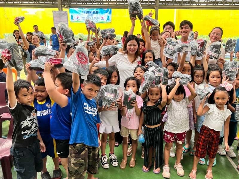 QC kids receive free school bags, shoes, vitamins