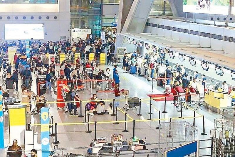 At least 100 OFWs repatriated from Kuwait arrive