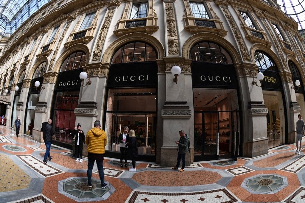 MILAN - JANUARY 13: Man with Louis Vuitton bag and white Gucci