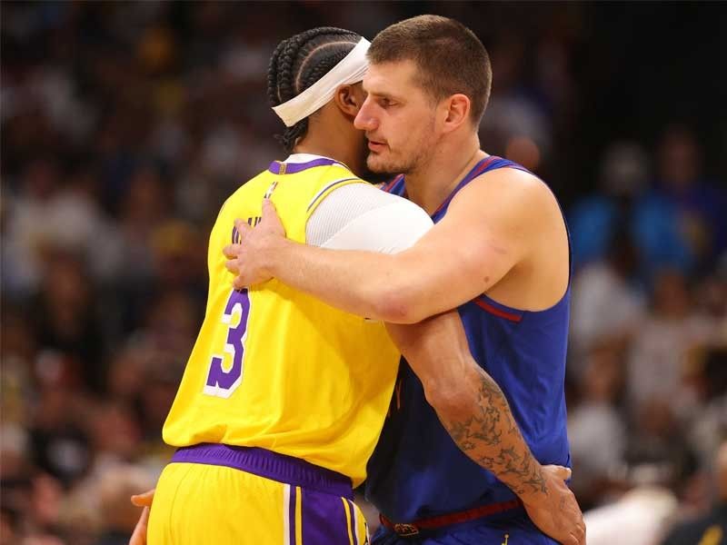Jokic dominates with triple-double as Nuggets edge Lakers in NBA season opener