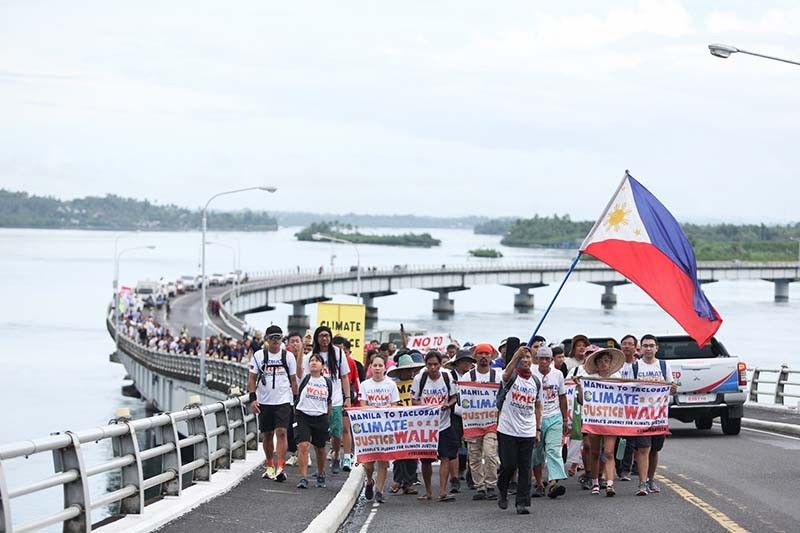 â��Climate walkersâ�� reach Tacloban on eve of Yolanda 10th anniversary