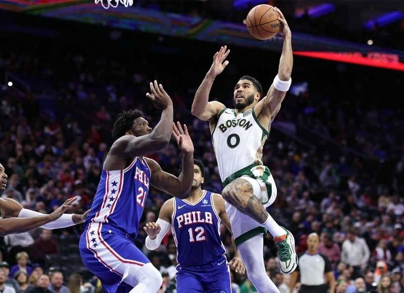 Celtics seize top spot in east Lillard sparks bucks past Raptors