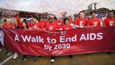 Participants including Philippine health official Enrique Tayag (front 3rd R) take part in the &quot;walk to end AIDS&quot; event to mark World Aids Day in Manila on December 2, 2023. HIV infections are soaring in the Philippines, with experts blaming online dating, poor sex education and conservative attitudes in the deeply religious country for fuelling the spread of the virus.
