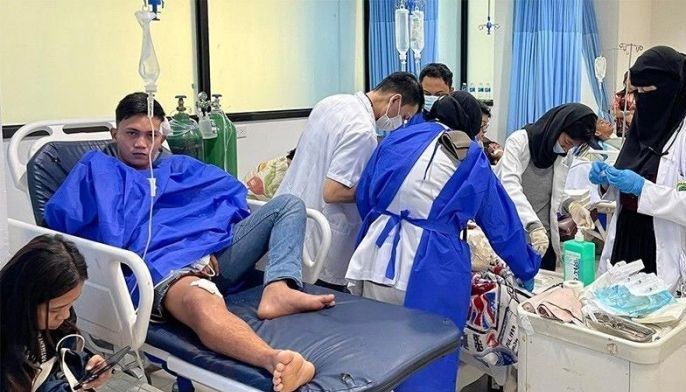 Muslim personnel of the Amai Pakpak Hospital in Marawi City treat non-Muslims who were hurt during Dec. 3, 2023's bombing at the Mindanao State University in Marawi City. 