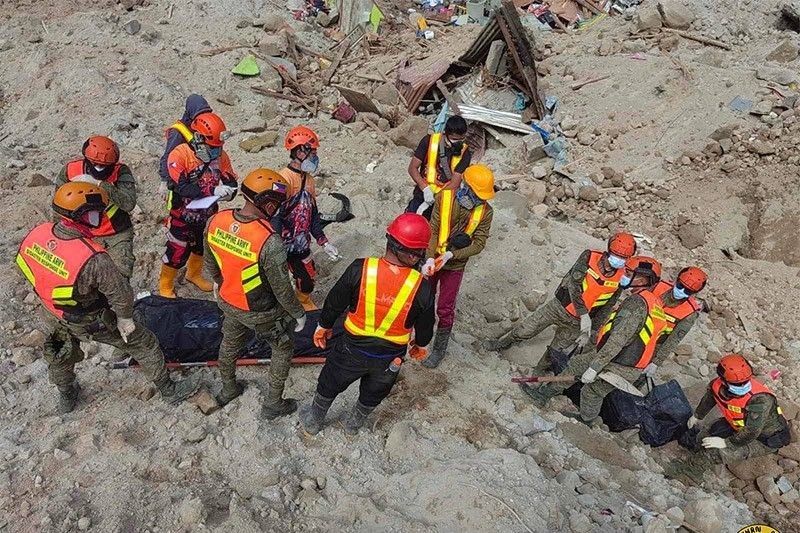 Unidentified landslide victims buried in temporary graves