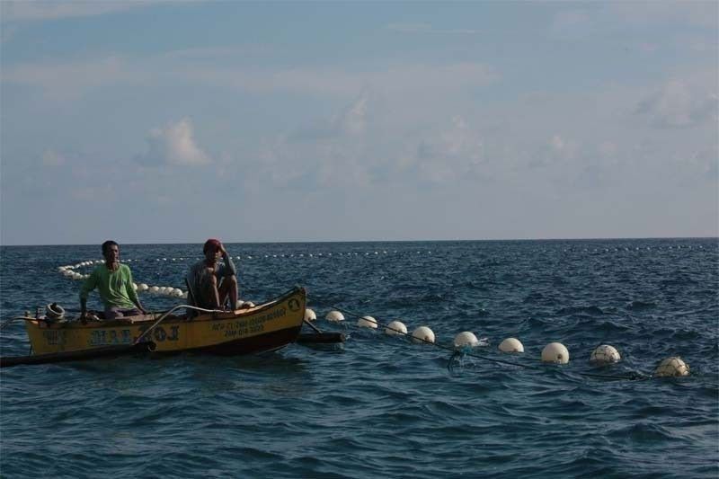 China inalis na floating Â­barriers sa Bajo de Masinloc