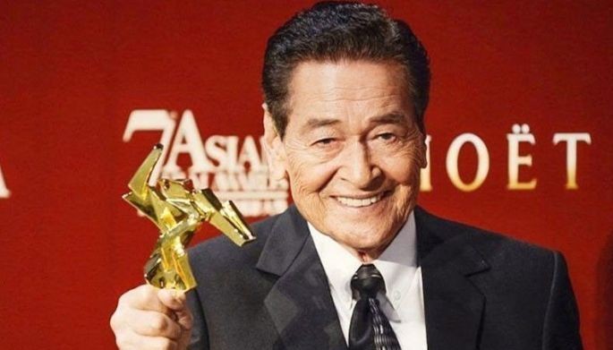 Actor Eddie Garcia poses with his Best Actor award at the 7th Asian Film Awards in Hong Kong in this March 18, 2013 photo.
