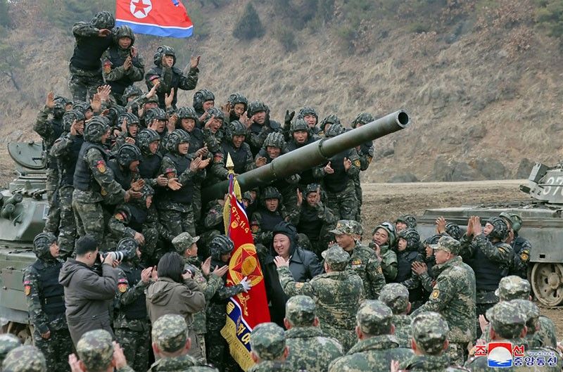 North Korean leader Kim oversees paratroop drills