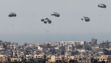 This picture taken from Israel's southern border with the Gaza Strip shows parachutes of humanitarian aid dropping over the besieged Palestinian territory on March 27, 2024, amid the ongoing conflict between Israel and the militant group Hamas.