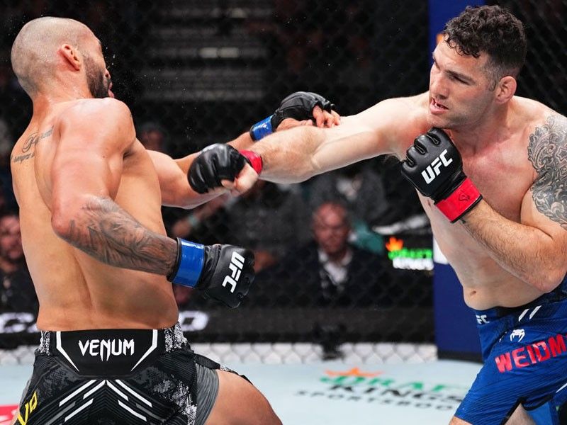 Weidman scores controversial eye poke win in UFC Fight Night