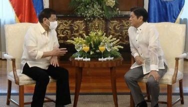 President Ferdinand Marcos Jr. talks with outgoing president Rodrigo Duterte at the President's Hall, Malaca&Atilde;&plusmn;ang Palace on June 30, 2022.