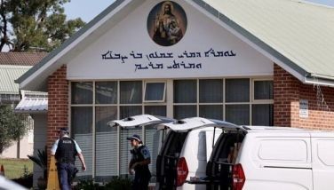 Police officers and their vehicles can be seen outside the Christ the Good Shepherd Church in Sydney's western suburb of Wakeley on April 16, 2024. Australian police on April 16 said a brutal knife attack during a live-streamed church service was a religiously motivated &quot;terrorist&quot; act, as they urged calm from the angered local community.