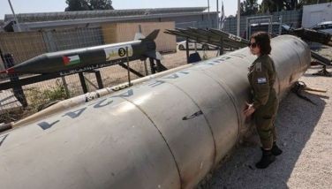 A member of the Israeli military stands next to an Iranian ballistic missile which fell in Israel on the weekend, during a media tour at the Julis military base near the southern Israeli city of Kiryat Malachi on April 16, 2024. Iran carried out an unprecedented direct attack on Israel overnight April 13-14, using more than 300 drones, cruise missiles and ballistic missiles, in retaliation for a deadly April 1 air strike on the Iranian consulate in Damascus. Nearly all were intercepted, according to the Israeli military.