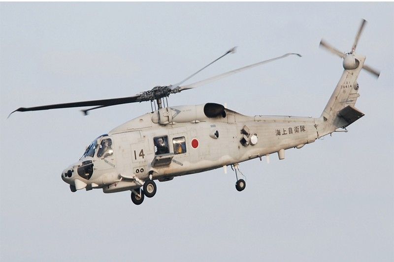 One dead, seven missing after two Japanese military helicopters crash