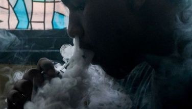This photo illustration shows a customer smoking at a vape store in Manila on November 20, 2019. Just hours after Philippine President Rodrigo Duterte announced he would ban e-cigarette use, police were ordered on November 20 to begin arresting people caught vaping in public and to confiscate the devices.