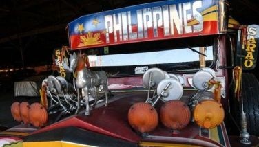 In this photo taken on April 3, 2024, an older model of a passenger jeepney produced since the 1950s by Sarao Motors, is displayed at the workshop in Las Pinas City, suburban Manila. About 70 years after the first jeepneys rolled on to the streets of the Philippines, the noisy, smoke-belching vehicles face an existential threat from a plan to replace them with modern mini-buses.