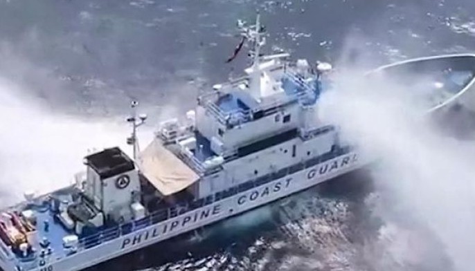 This frame grab from handout video footage taken and released on April 30, 2024 by the Philippine Coast Guard (PCG) shows the Philippine Coast Guard ship BRP Bagacay being hit by water cannon from Chinese coast guard vessels near the chinese-controlled Scarborough shoal in disputed waters of the South China Sea. 