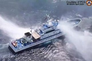 This frame grab from handout video footage taken and released on April 30, 2024 by the Philippine Coast Guard (PCG) shows the Philippine Coast Guard ship BRP Bagacay being hit by water cannon from Chinese coast guard vessels near the chinese-controlled Scarborough shoal in disputed waters of the South China Sea. 