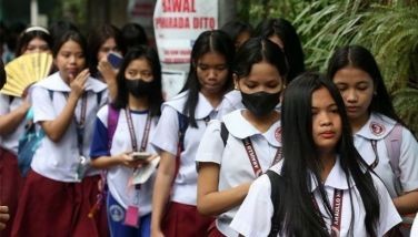 Students line up to enter Araullo High School in Manila on January 15, 2024.