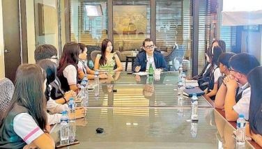 RFM chairman, president and CEO Joey Concepcion chats with senior high school students from the Raja Soliman Science High School at the food and beverage giant&acirc;��s boardroom in Mandaluyong City. With Concepcion is his daughter Bella, who shared with the students her experience as an influencer and digital entrepreneur.