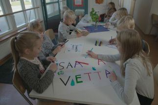 Schoolchildren in the northwestern town of Ii in Finland learn about recycling, sustainability and measuring carbon emissions; the sign reads &acirc;��Conserve water.&acirc;�� 