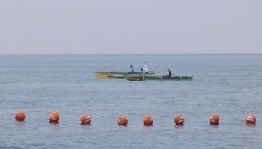 Local fisherfolk place the symbolic buoys with markings &acirc;��WPS Atin ito!&acirc;�� on the Philippine Exclusive Economic Zone before pushing to the Bajo de Masinloc during the second civilian resupply mission to the West Philippine Sea on May 15, 2024.
