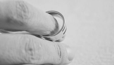 Stock image of a hand and marriage ring