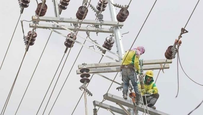 Stock image of electrical linemen.