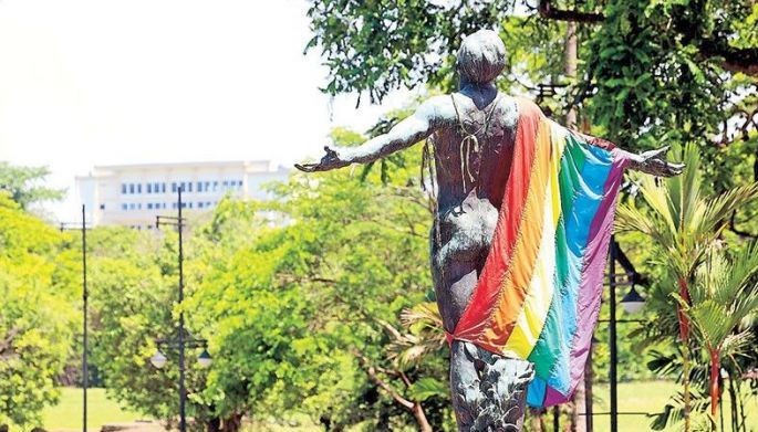 The Oblation at the University of the Philippines in Diliman, Quezon City is draped with a rainbow flag yesterday in celebration of Pride Month.
