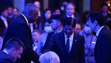 US Secretary of Defense Lloyd Austin (L) shakes hands with Philippines' President Ferdinand Marcos Jr. during the 21st Shangri-La Dialogue summit in Singapore on May 31, 2024.