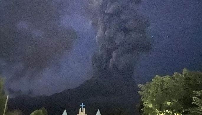 This handout photo courtesy of Dollet Demaflies shows Mount Kanlaon volcano spewing a large plume of ash during an eruption as seen from La Castellana town, Negros occidental province, central Philippines on June 3, 2024.
