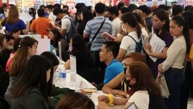 Jobseekers queue for an interview at the job fair organized by the local government inside a mall in Marikina City as part of their observance of Labor Day on May 1, 2024.