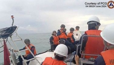 This handout photo grabbed from a video released by the Philippine Coast Guard on June 7, 2024 shows Chinese Coast Guard personnel (L) aboard their rigid inflatable boat, blocking a Philippine Coast Guard (R) rigid inflatable boat carrying marine scientists in the waters of the South China Sea. The Philippine Coast Guard said on June 7, that Chinese boats &quot;harassed&quot; their vessel during a medical evacuation last month of a Filipino soldier, who was stationed on a remote outpost in the South China Sea.