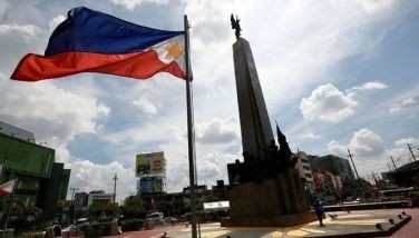 A worker cleans the surroundings of the Andres Bonifacio Monument in Caloocan City on June 9, 2024 in preparation for the celebration of the 126th Philippine Independence Day on June 12.