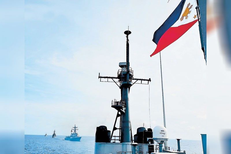 China boards Philippines resupply boat; Navy men hurt