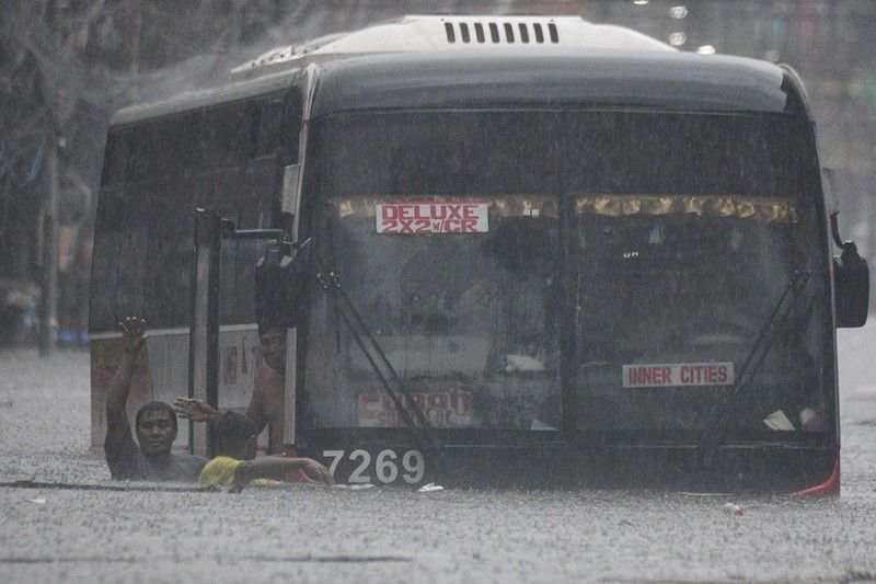 Streets turned into rivers as Typhoon Carina hits Philippines