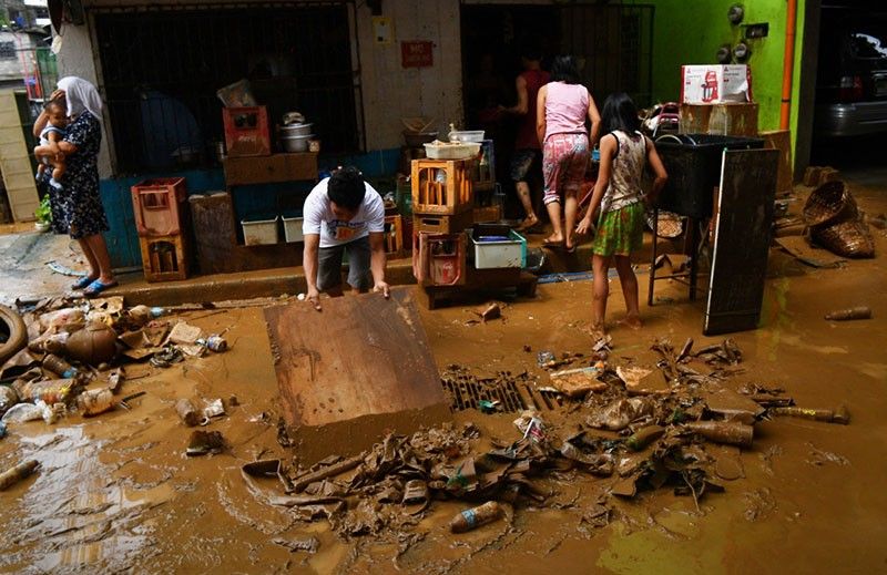 'Back to zero': Manila flood victims clean up, start again