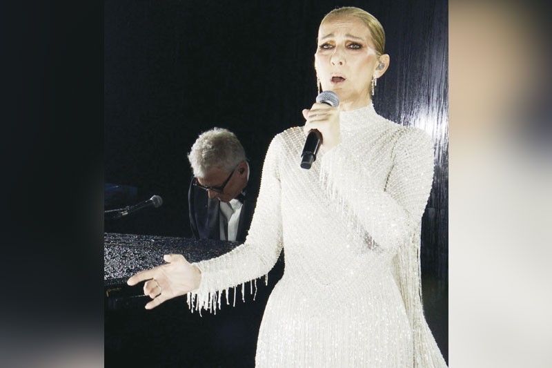 Celine Dion sings on Eiffel Tower at end of Olympics opening ceremony