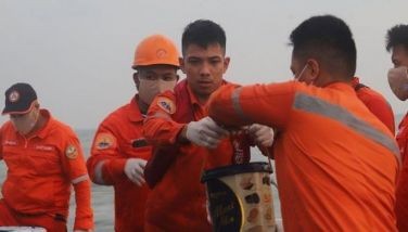 In this photo posted on Facebook on July 26, 2024, Philippine Coast Guard Marine Environmental Protection personnel continue to lay oil dispersants and collect emulsified oil in the affected waters.